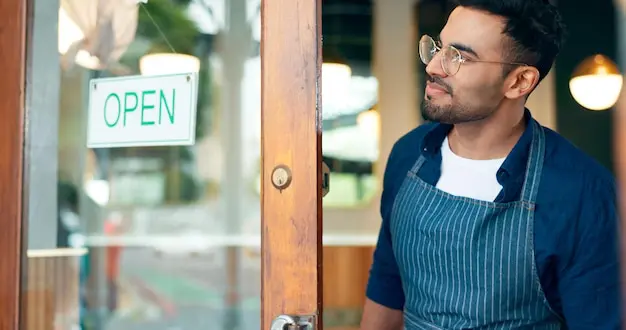 manager small business open sign front door cafe restaurant service advertising ready start waiter by board poster welcome message entrance diner coffee shop